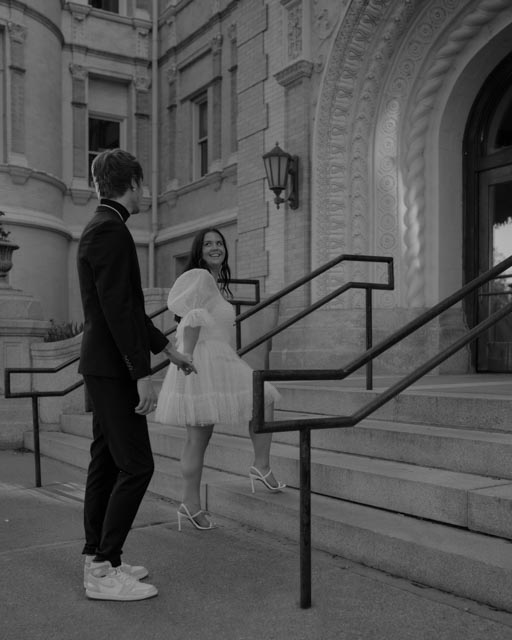 couple walking up the steps at the Spokane Courthouse for their elopement.  