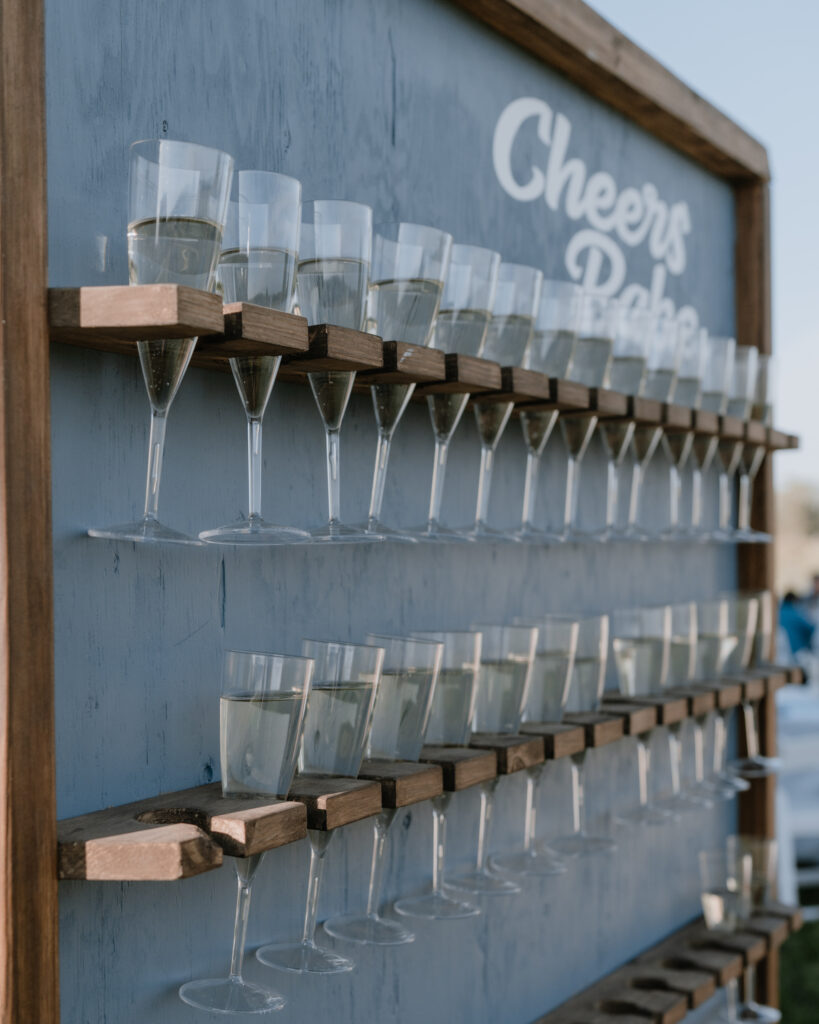 champagne wall with glasses filled with champagne for toasting.