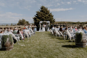 bride and groom standing at the alter during the ceremony.