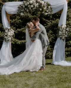 bride and groom kissing at the end of the ceremony.