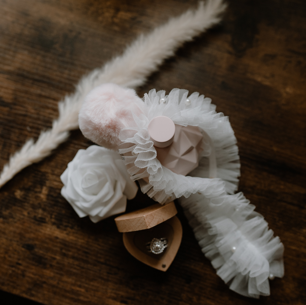 Bride's perfume, ring and garter belt