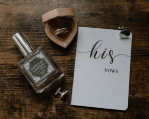 groom's details such as cologne, ring, vow book and custom cuff links as a gift from the bride.