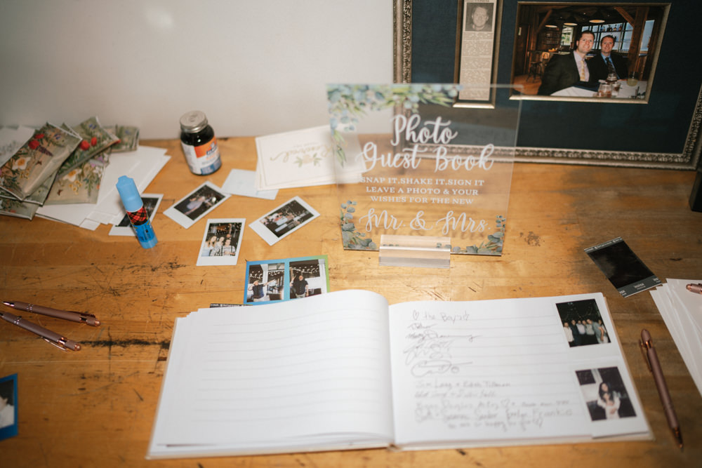 flash moment of guest book with fun polaroid photos and signatures.  