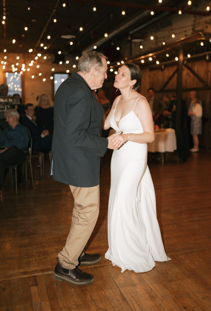 Bride and father dance at Overbluff Cellars.