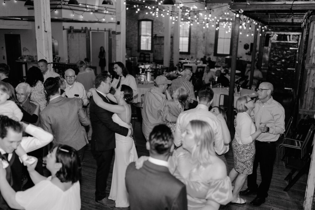 bride and groom dancing during the reception of their documentary wedding at Overbluff Cellars.