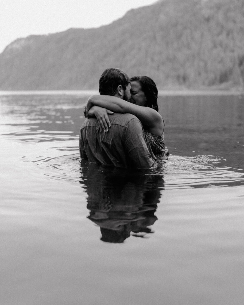 couple hugging in the water for their Idaho surprise proposal.