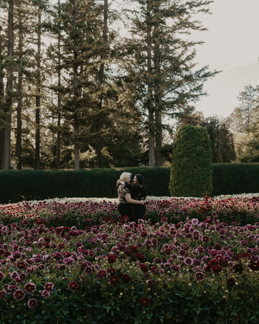 Couple hugging each other in the Duncan Garden Manito Park for their Fall engagement session