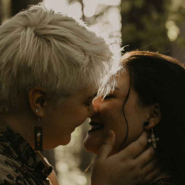 Couple about to kiss during their fall engagement session at Manito Park.