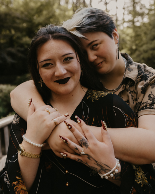 couple hugging and smiling at Manito Park's Japanese garden.