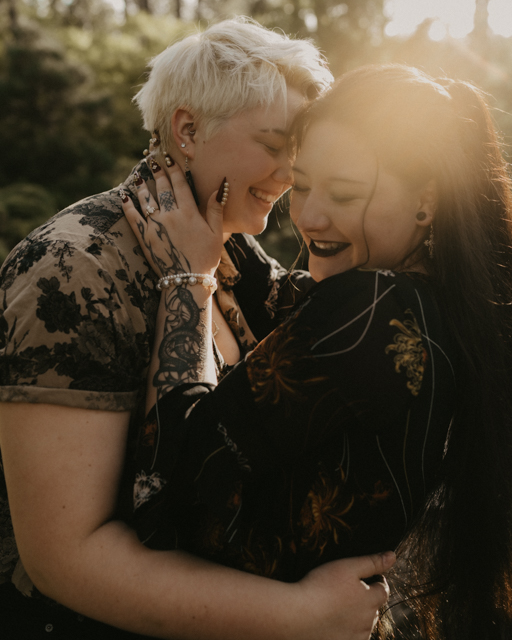 couples smiling and embracing for their engagement session at Manito Park