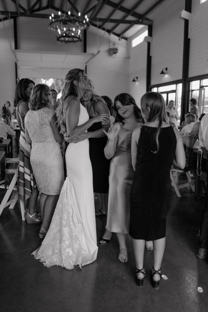 bride hugging her aunt during the reception.