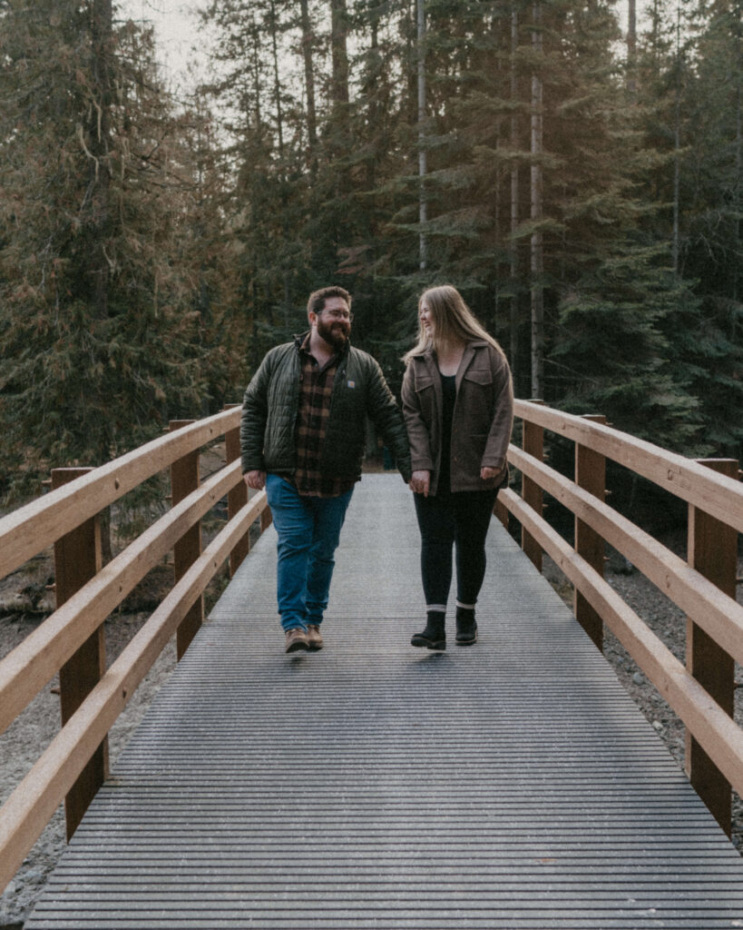 Idaho Winter Couples Session where the couple are walking and laughing