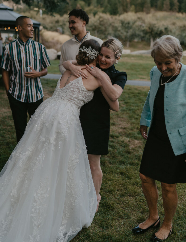 bride hugging her cousin during the reception of their wedding.