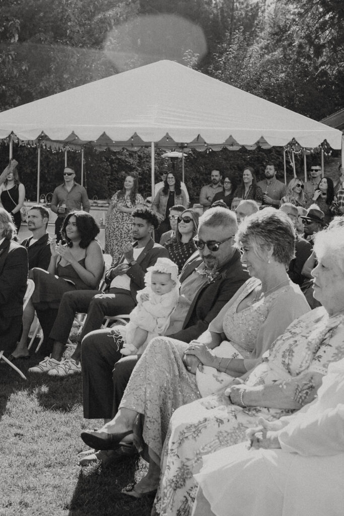 seated guests at the ceremony