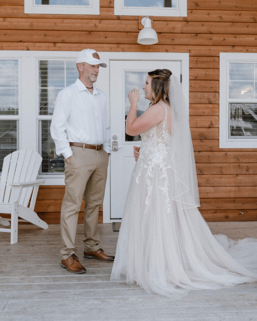 bride and her dad on the porch of their Airbnb for a first look