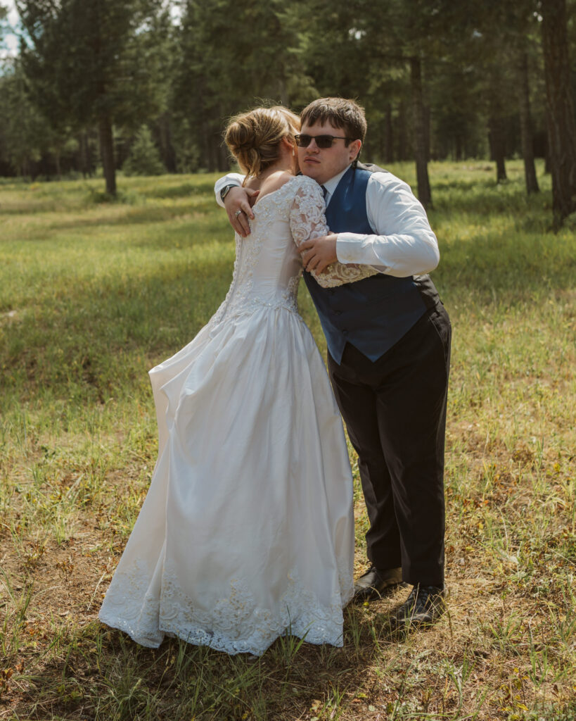 bride having a first look with her brother 