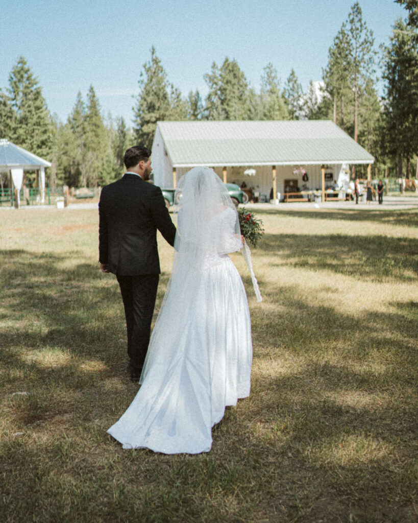 bride and groom walking back to the reception space after the ceremony