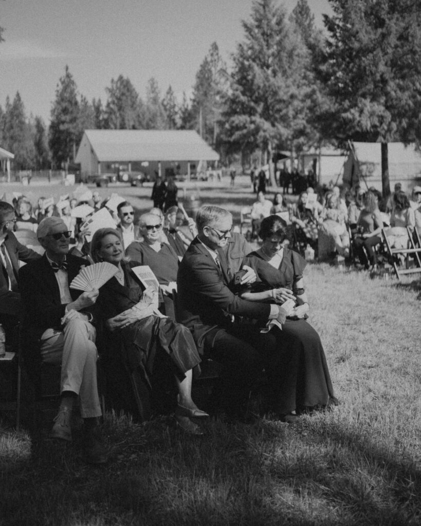 candid guests at the ceremony waiting for it to start
