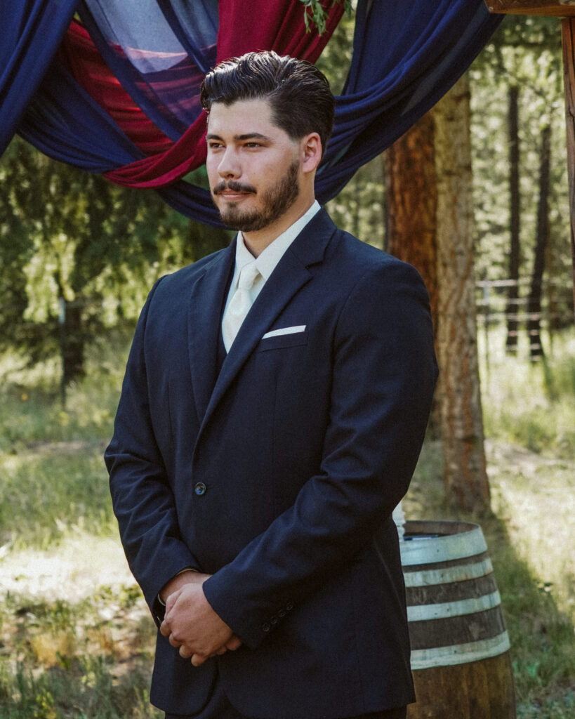 groom watching the bride walk up the aisle.